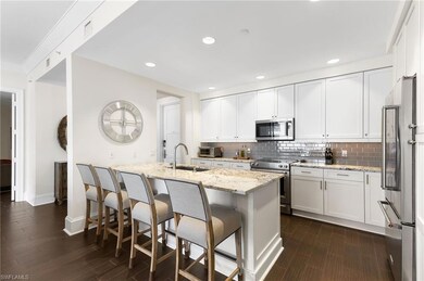 Kitchen featuring stainless steel appliances, a si