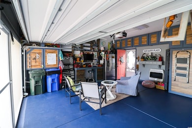 Garage with stainless steel fridge, heating unit, 