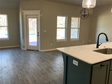 Kitchen featuring dark hardwood / wood-style floor