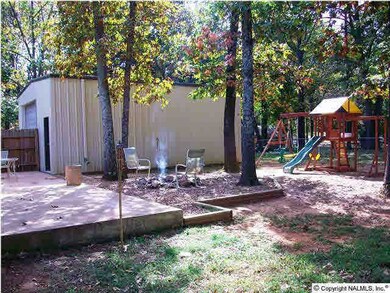 spacious backyard with firepit area, patio and enough room to bring your swingset for the kids