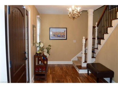 Enter the foyer through the solid wood front door 