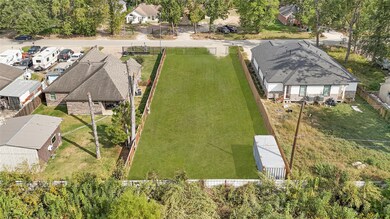 Spacious frontage with easy access and plenty of room for parking or future driveway space.