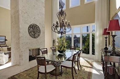 Dining Room wi 2- stroy ceiling   fireplace