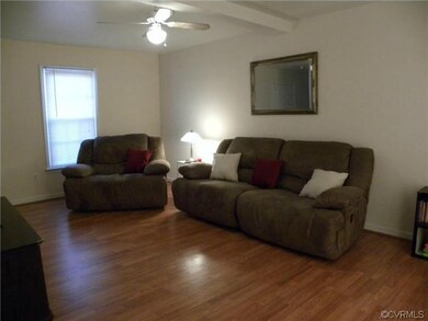 Large great room with french doors leading to deck