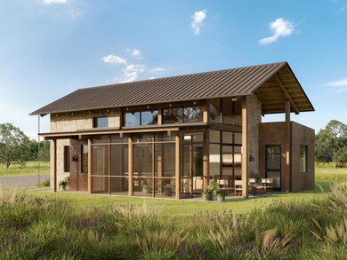 Back of house featuring metal roof, a standing se