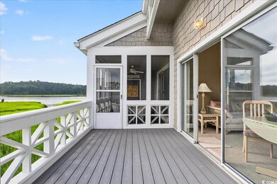 Wooden terrace featuring a sunroom