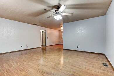 Living room has access to hallway/dining/kitchen