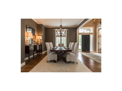 Gracious dining room. Note plantation shutters thr