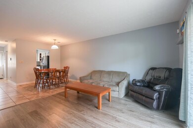 Living area featuring light wood-style flooring an