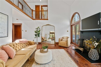 Living room featuring a towering ceiling and dark