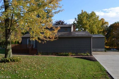 Rear elevation of home. Small deck off kitchen are