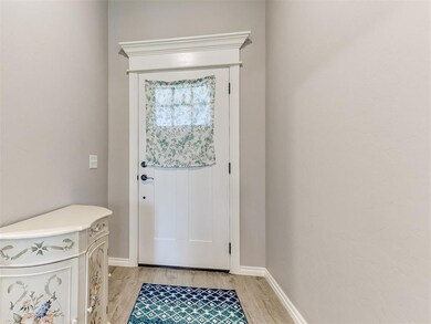 Doorway featuring light wood-type flooring