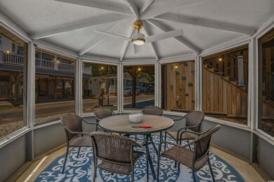 Sunroom / solarium with vaulted ceiling and a ceiling fan