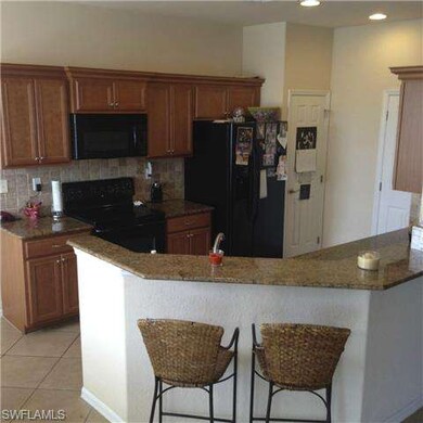 12859 Carrington Cir unit 202, Naples, FL 34105 - photo 2