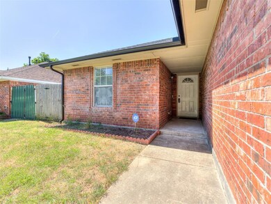 Doorway to property with a lawn