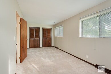 The master bedroom is quite large and has ample cl