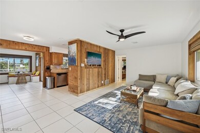 Tiled living room with ceiling fan