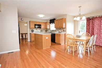 Spacious Eat-In Kitchen has Brand New Hardwood Floors and is Freshly Painted!