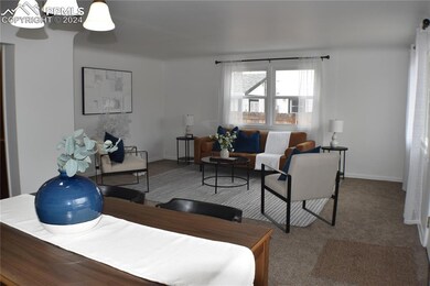 Living room featuring carpet floors