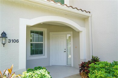 Property entrance with stucco siding and a tiled roof