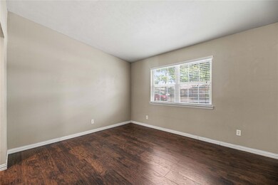 Unfurnished room with hardwood / wood-style floori