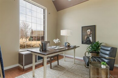 Office with picture window off front entry