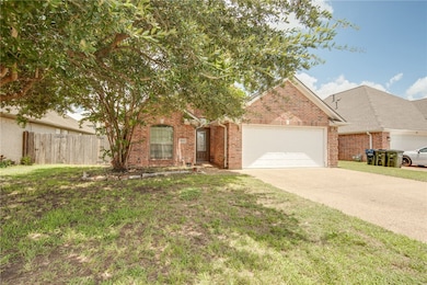 View of front of property featuring an attached ga