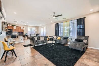 Living room featuring light tile patterned floors, baseboards, visible vents, recessed lighting, and ceiling fan