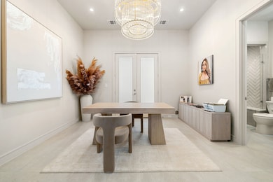 Soft lighting from a chic chandelier complements t