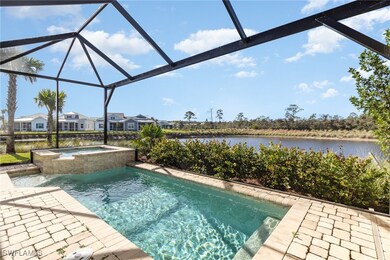 View of pool featuring a lanai, a water view, an i