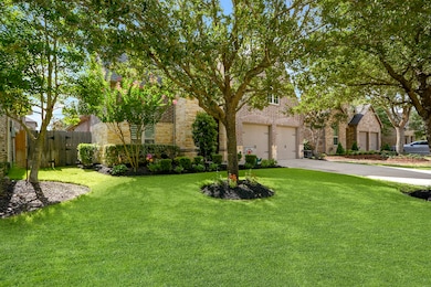 Another view of this amazing well kept home, professionally manicured landscaping front and back, impressive curb appeal. View of the Home with the long wide driveway to the 2 car garage!