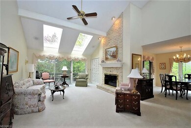 Stunning two story living room with large skylight