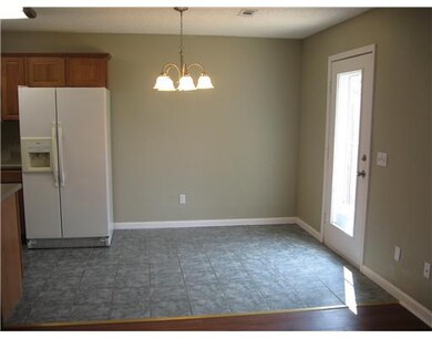 Dining Room. Eat-in kitchen dining area. Patio door has storm door and accesses privacy fenced backyard.