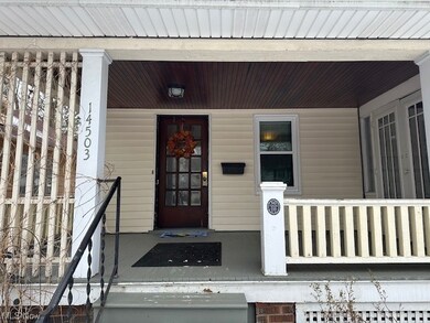 Charming doorway to property with a front porch.