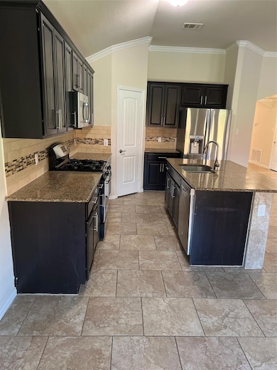 Kitchen featuring stove, dishwasher, refrigerator