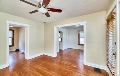 Living room, looking into main floor bedroom and d