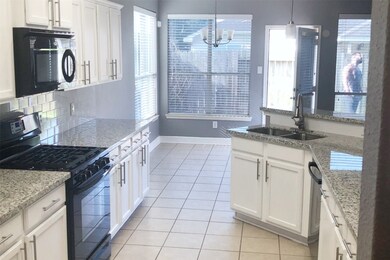 Freshly painted cabinets and new granite countertops