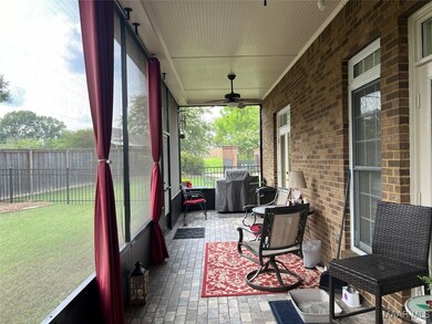 Back porch with brick tile flooring
