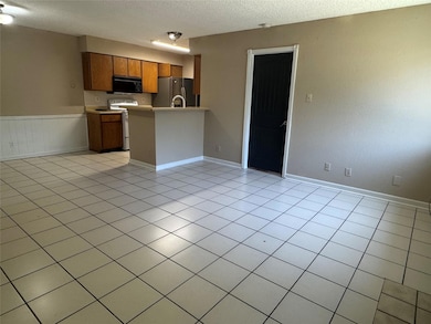 Kitchen featuring black microwave, stainless stee