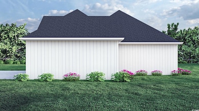 View of side of home with a lawn