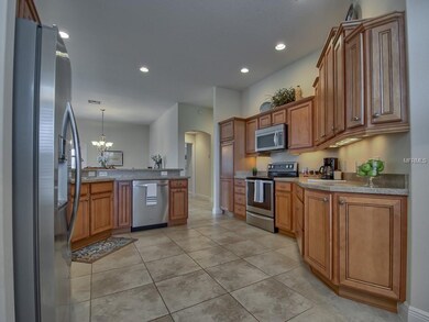 View of KITCHEN with STACKED, MAPLE GLAZED CABINET