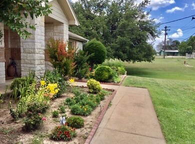 ore current photo of front landscaping.