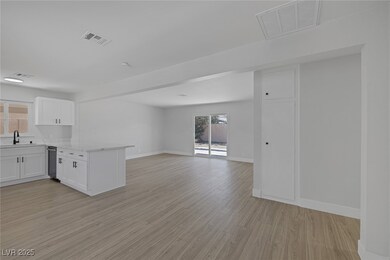 Kitchen featuring a peninsula, open floor plan, wh