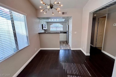 Unfurnished dining area featuring a chandelier and
