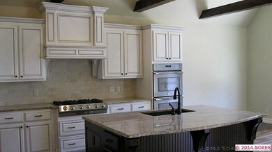 Kitchen w/ large Island, beams, double ovens and l