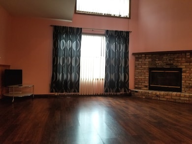 Patio door leads to wood patio & has view of pond.