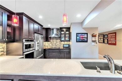 View FULLY remodeled kitchen to hall, half bath, g