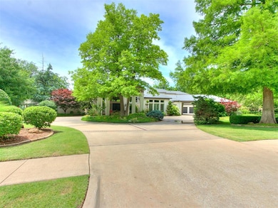 Mature trees and lush landscape adorn this propert