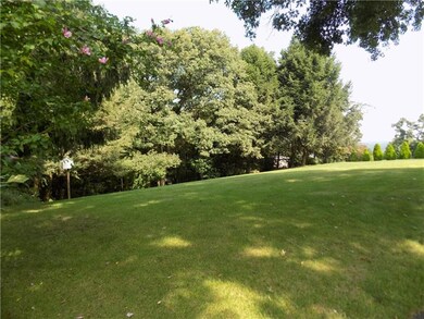 Additional lot in back provides woods for privacy.
