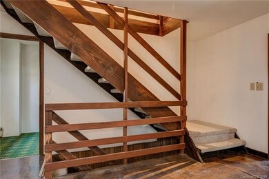 Foyer with stairs to second floor bedrooms and dow